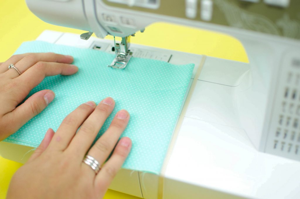 put a rubber band around the arm of your sewing machine as a seam guide