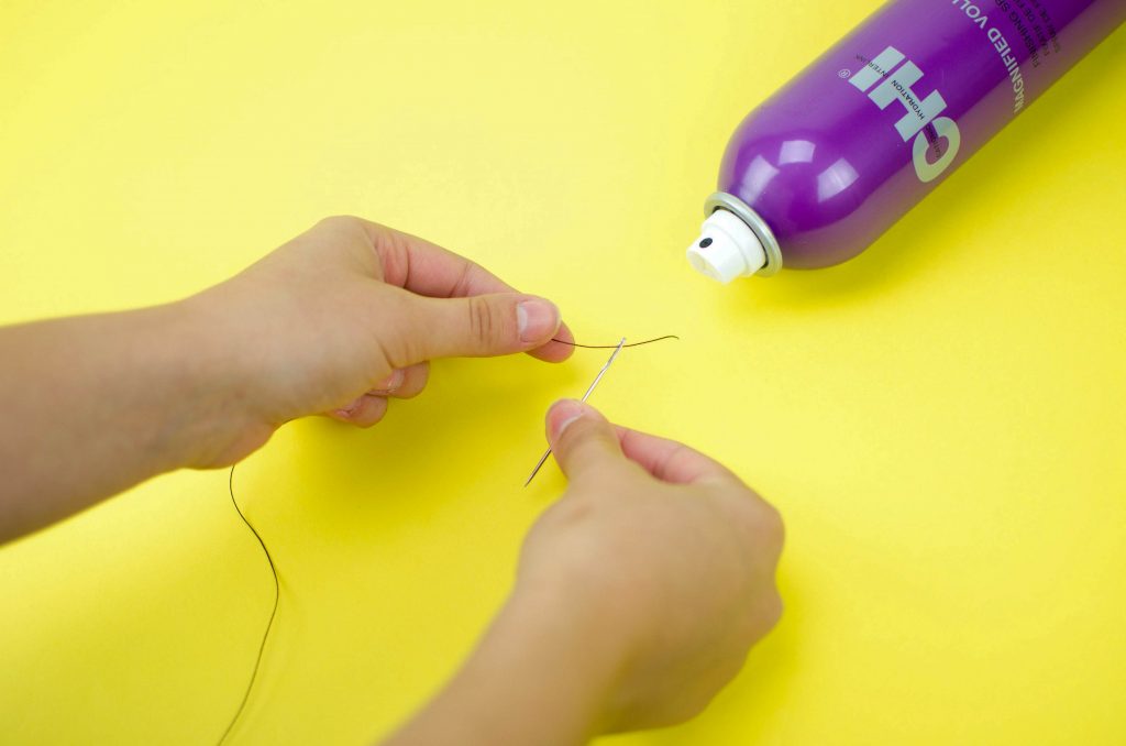 spray end of thread with hairspray to make threading needle easier