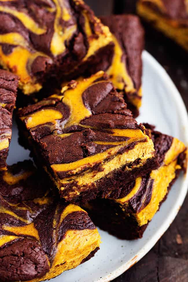 Bars of perfectly moist and fudgy brownies swirled with pumpkin cheesecake