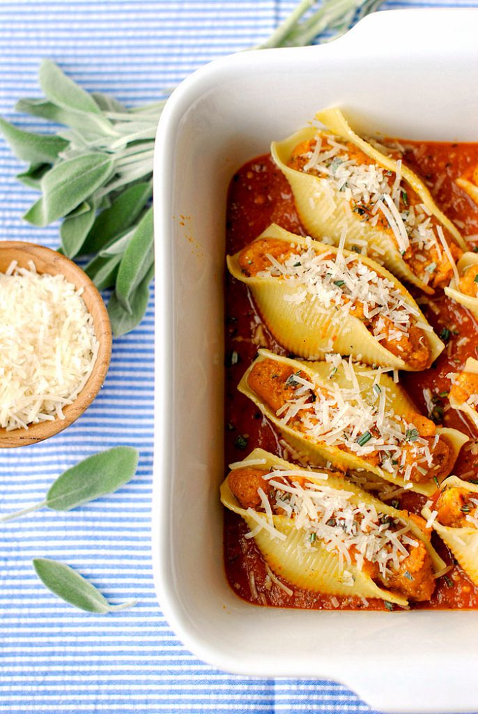 Healthy pumpkin and sage stuffed shells sprinkled with additional pecorino cheese