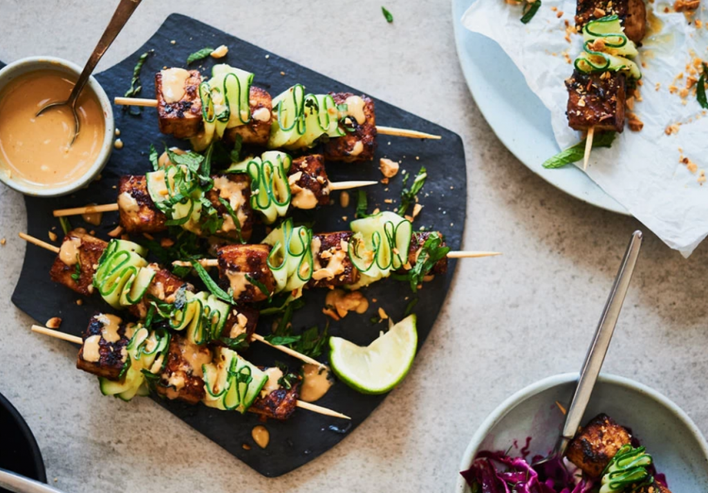 Cucumber skewers topped with toasty peanuts and fresh mint served with tofu peanut satay sauce