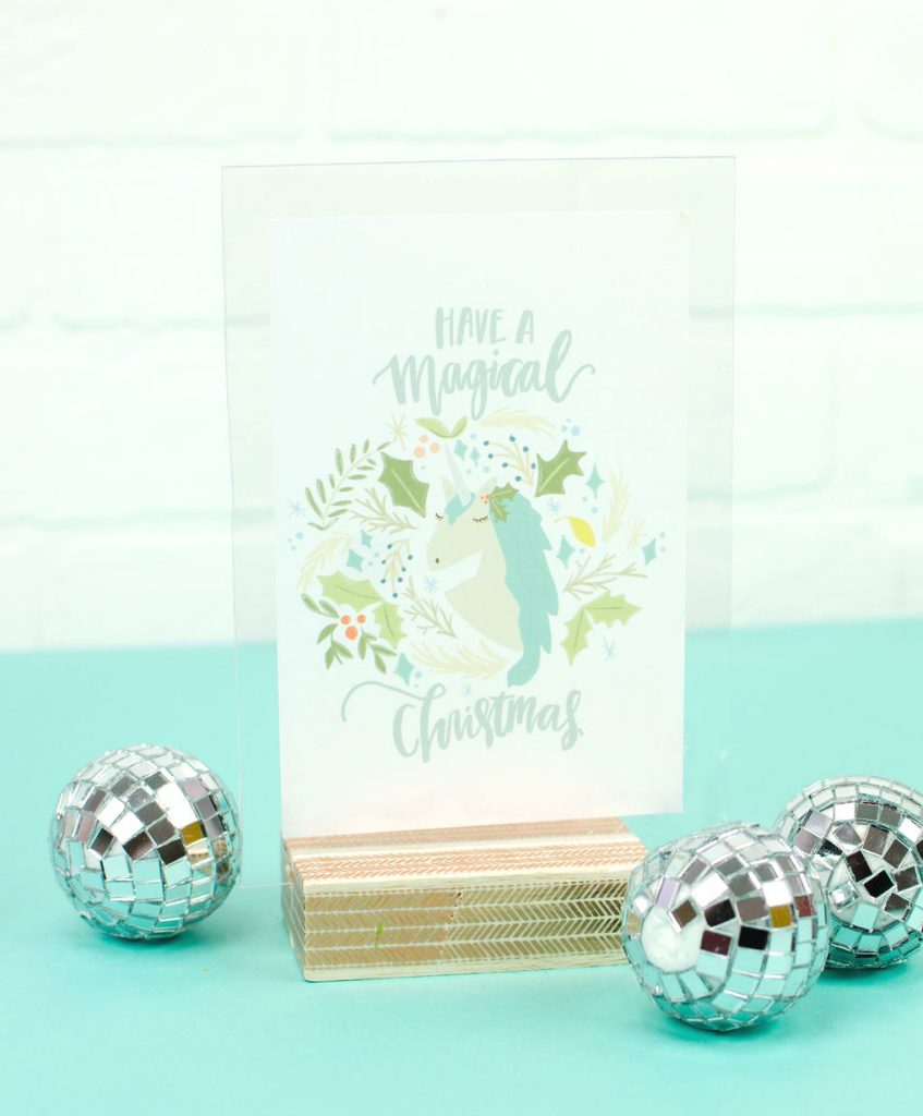 Super cute wood block photo display of a unicorn with a text saying Have a Magical Christmas