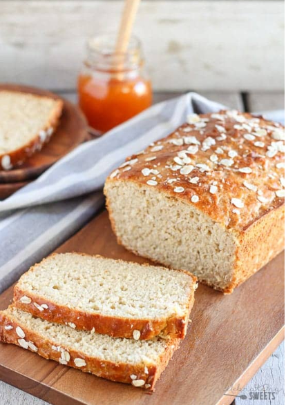 Honey Oat Quick Bread, yeast free bread made with oats and wheat flour, sweetened with honey, and baked until golden brown.