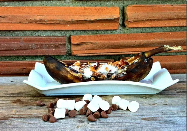 Grilled banana boats stuffed with chocolate chips, marshmallows and other goodies.