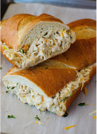 creamy chicken stuffed French bread with ranch dressing, cheese, and onion