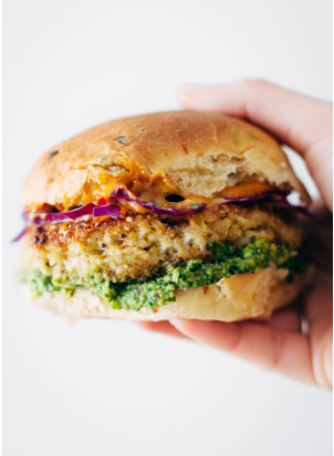 spicy cauliflower burger with chopped cilantro and chopped cabbage