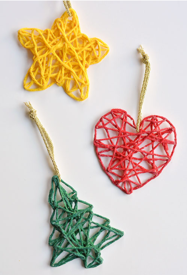 A yellow star, a red heart and green Christmas tree yarn ornaments