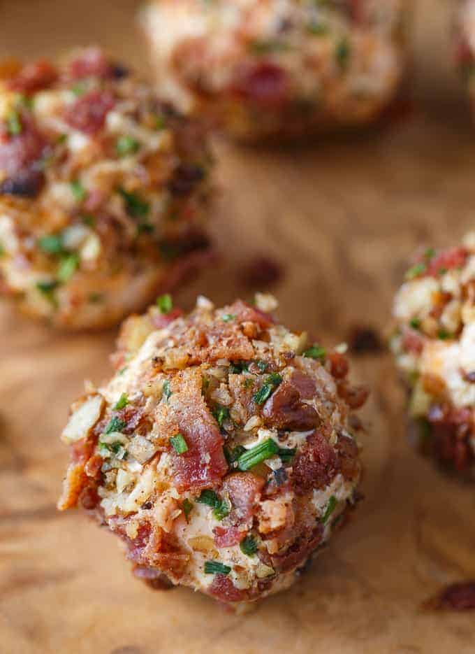 delicious low carb bite sized keto cheese balls appetizer with cream cheese balls are rolled in a mixture of bacon, chives and pecans