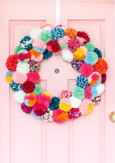 Bright and Colorful Boho Holiday Pom-Pom Wreath is a beautiful Christmas decoration