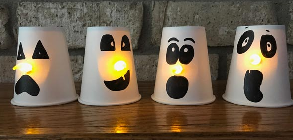 Paper cup ghosts with glowing noses