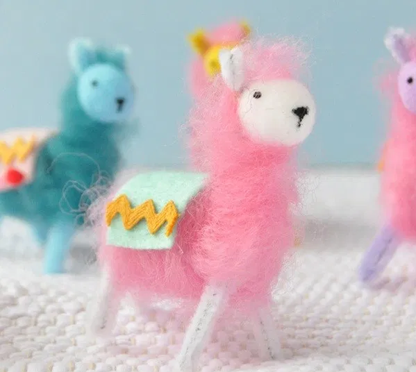 Miniature llamas out of pipe cleaner and wool