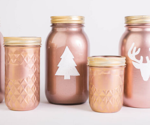 Different kind and sizes of mason jars painted with rose gold