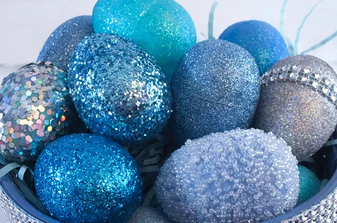 Color blue glittery and beaded plastic Easter eggs