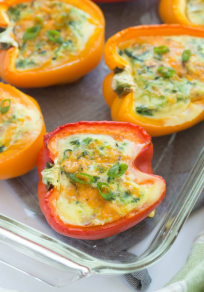 Bright and colorful Breakfast stuffed Peppers with cheese, bacon and spinach