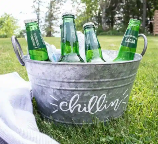 Homemade outdoor galvanized ice bucket party beverage tub with cricut for movie watching