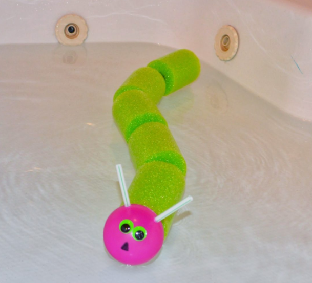 Pool noodle caterpillar craft in the tub