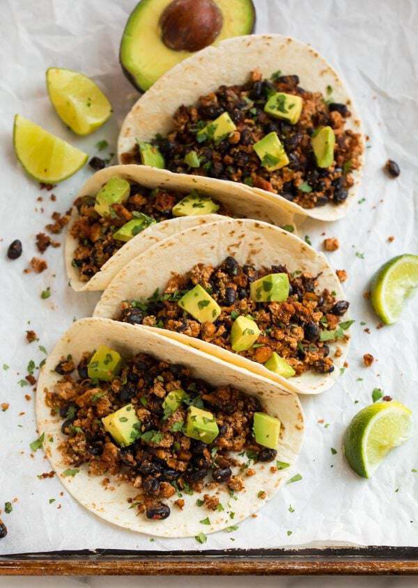 A healthy plant-based spicy tofu tacos with avocado and lime