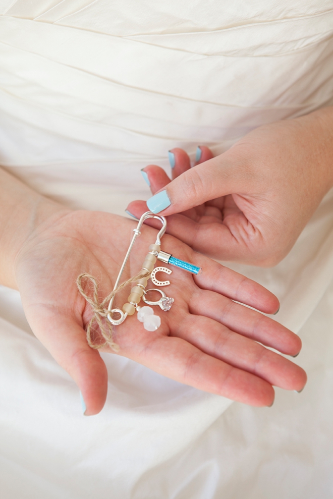 A cute beaded blue pin that is a perfect wedding accessory