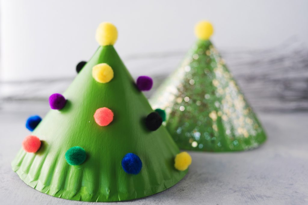 Paper Plate Christmas Trees with pom poms around one tree