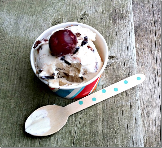 Scrumptious no-churn cherry balsamic ice cream with chocolate chunks topped with cherry
