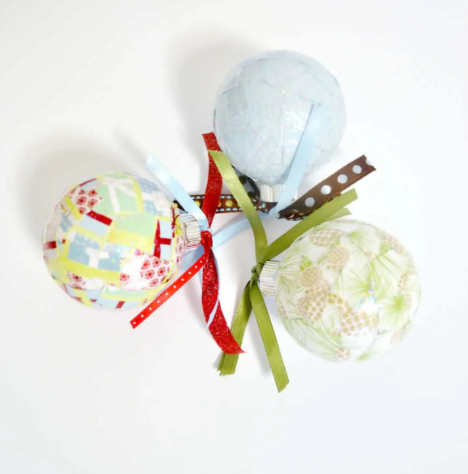 Christmas ornaments decorated with paper and Mod Podge.