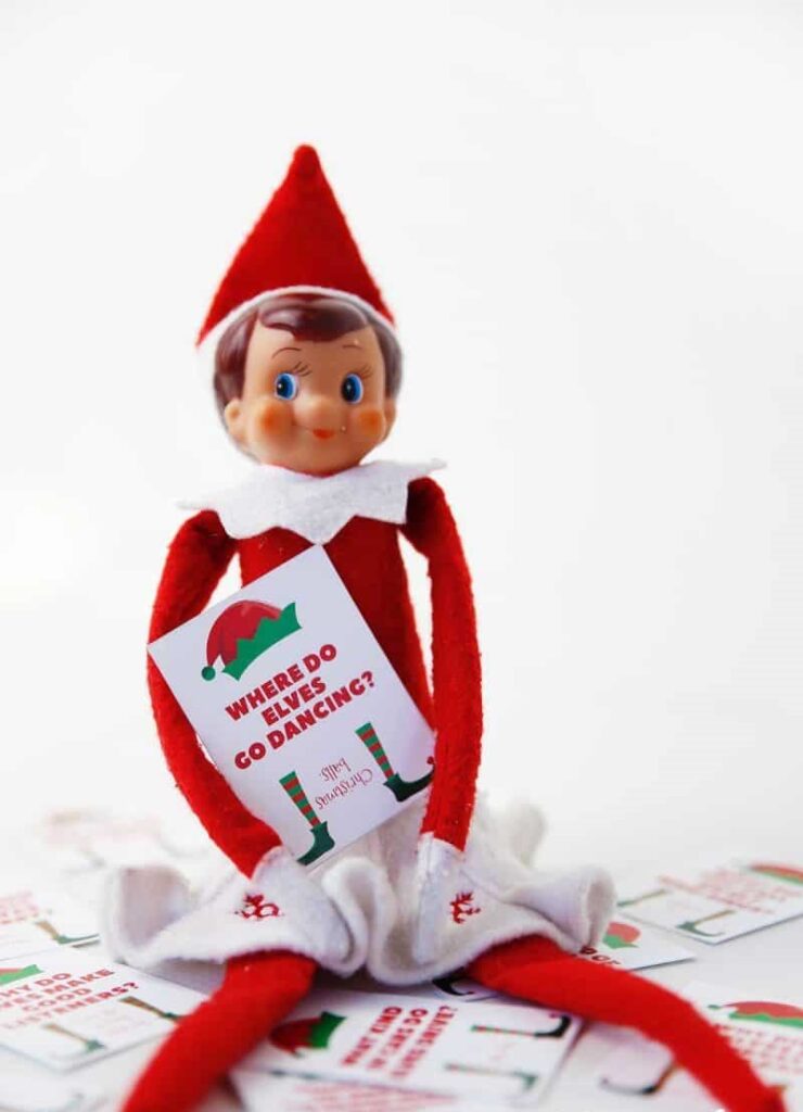 elf on the shelf smiling with his joke card