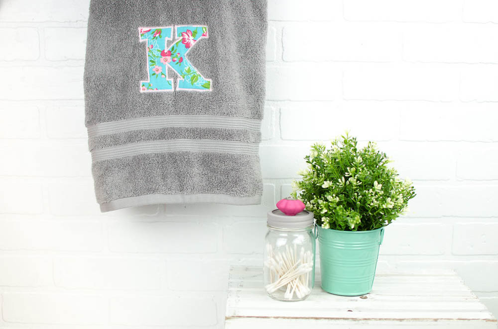 Towel with a monogram K on it