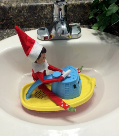 Elf on the shelf is floating on a boat
