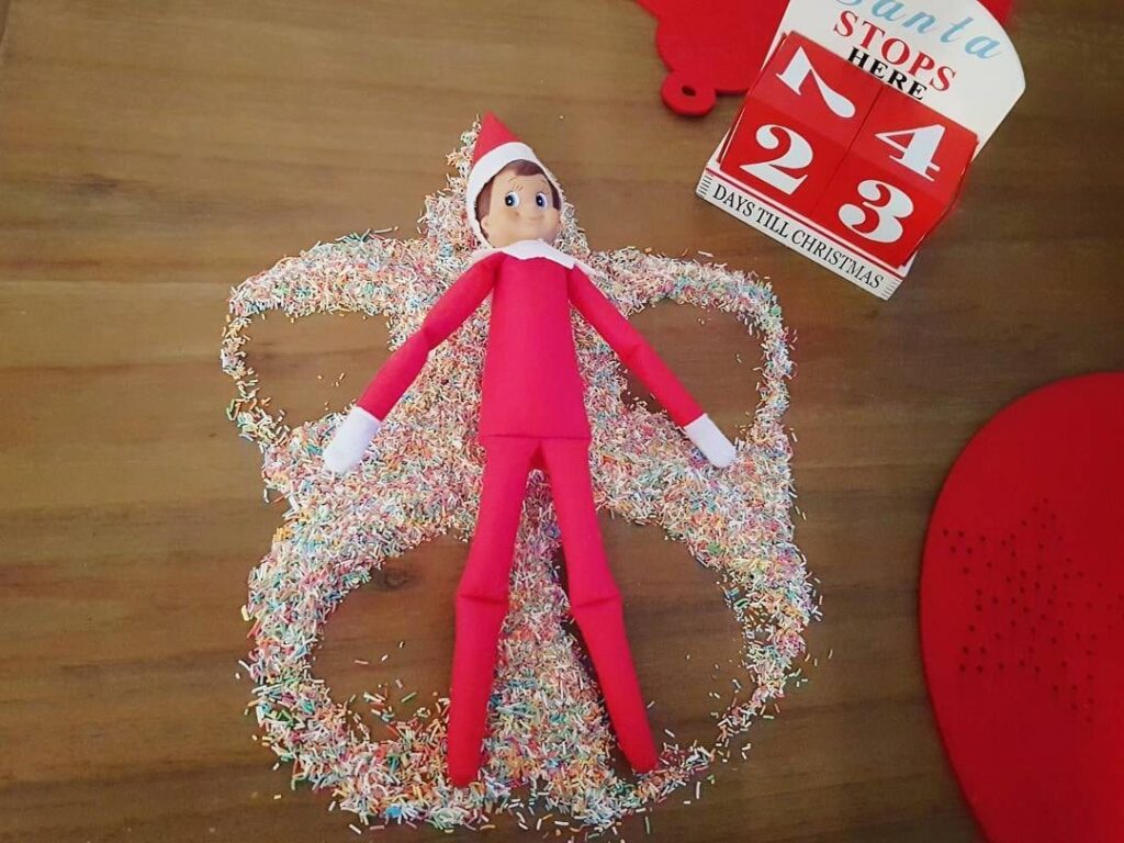 elf angel with wings made from sprinkles, flours, coconut, and sugar