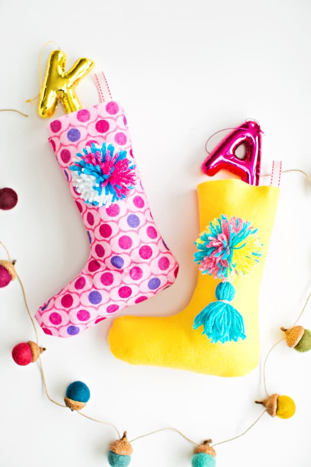 EASY DIY FELT POM POM STOCKINGS hanging up cute treats and trinkets for the kids