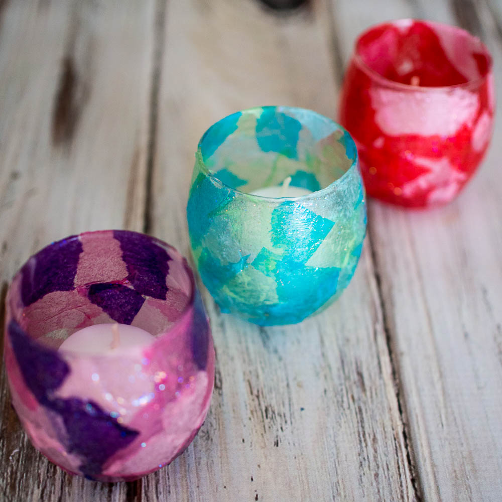 Candle holders covered with colored tissue paper to looks like a Stained Glass Votive Candle Holders