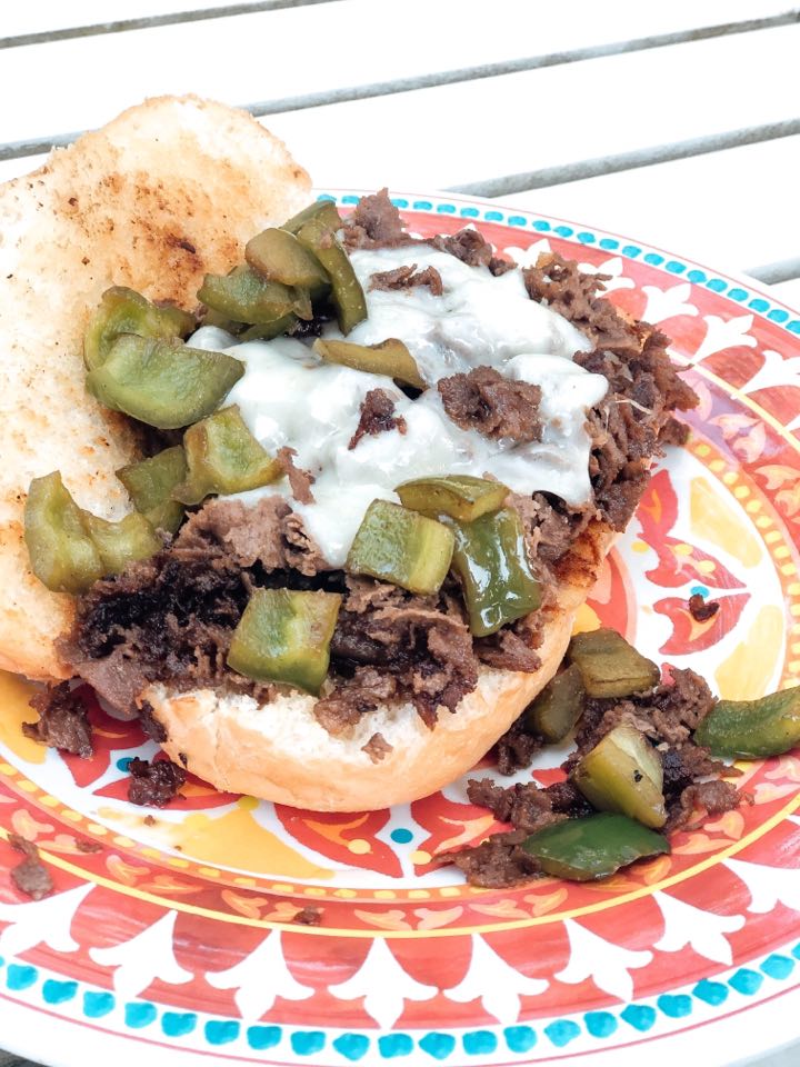 Philly cheesesteaks cook from the Blackstone Griddle on a toast 