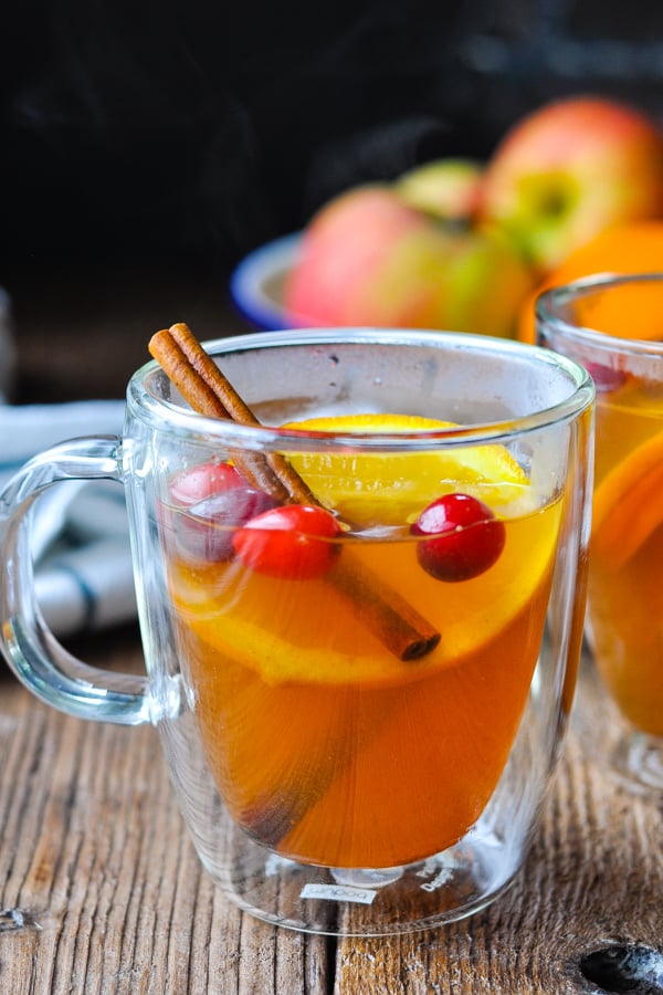 Mulled cider with cranberries, orange slices, and cinnamon sticks