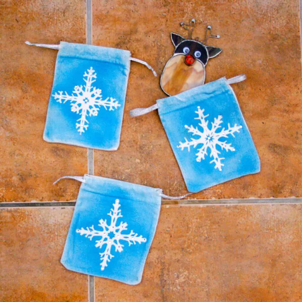 cute little painted snowflake gift pouches