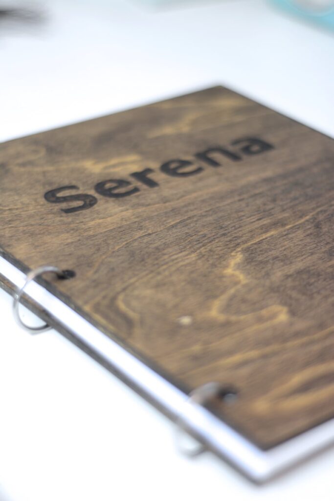 Homemade journal out of wood with a name Serena on it