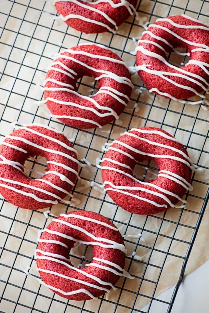 BAKED RED VELVET DONUTS Super moist and spongy topped with powdered sugar or classic vanilla icing