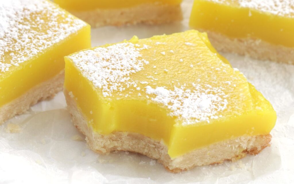 Vegan version of Lemon squares sprinkled with powdered sugar on top
