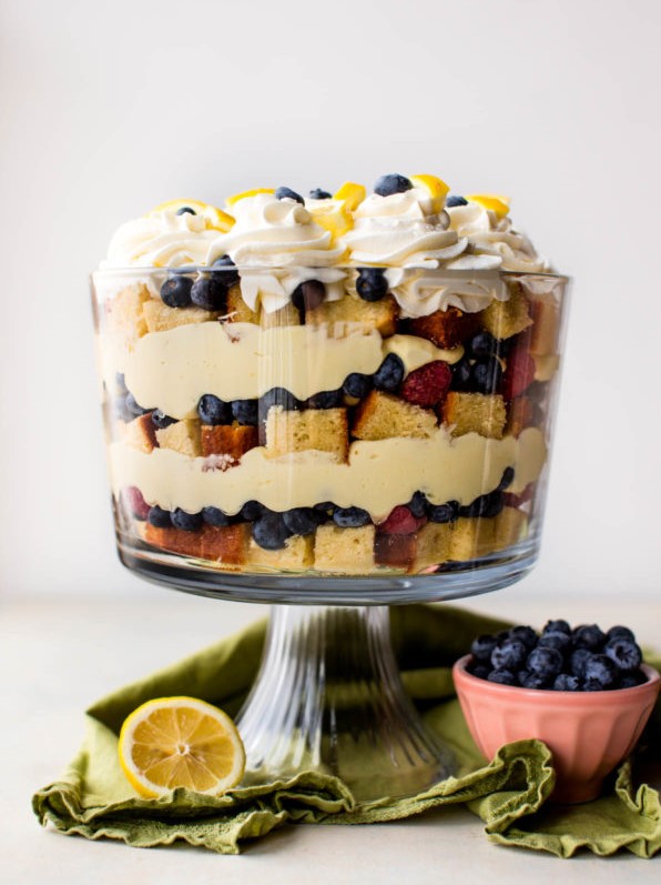 lemon berry trifle includes lemon pound cake, fresh berries, a lemon cheesecake filling, and fresh whipped cream