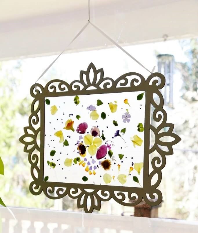contact paper suncatcher in a wood frame