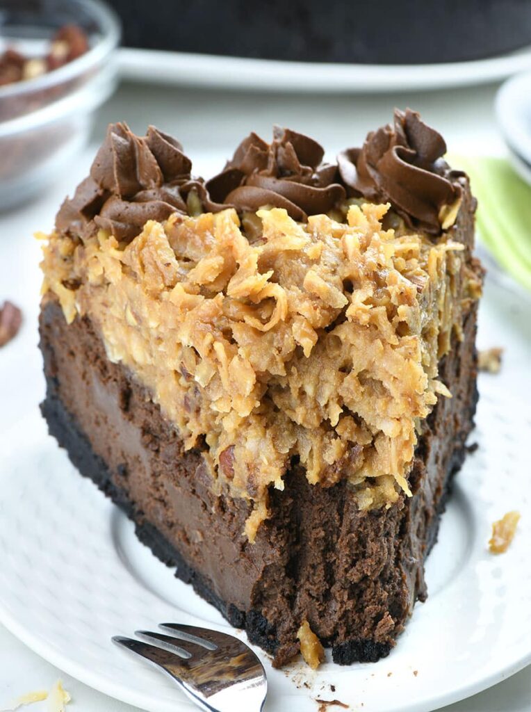 Delicious German Chocolate Cheesecake with crunchy Oreo crust and gooey coconut pecan topping