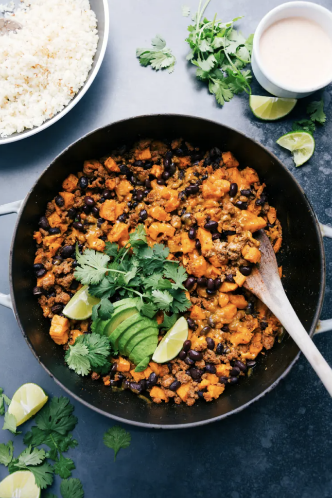 Ground Turkey Sweet Potato Skillet serve with freshly chopped cilantro and fresh lime wedges and diced avocado