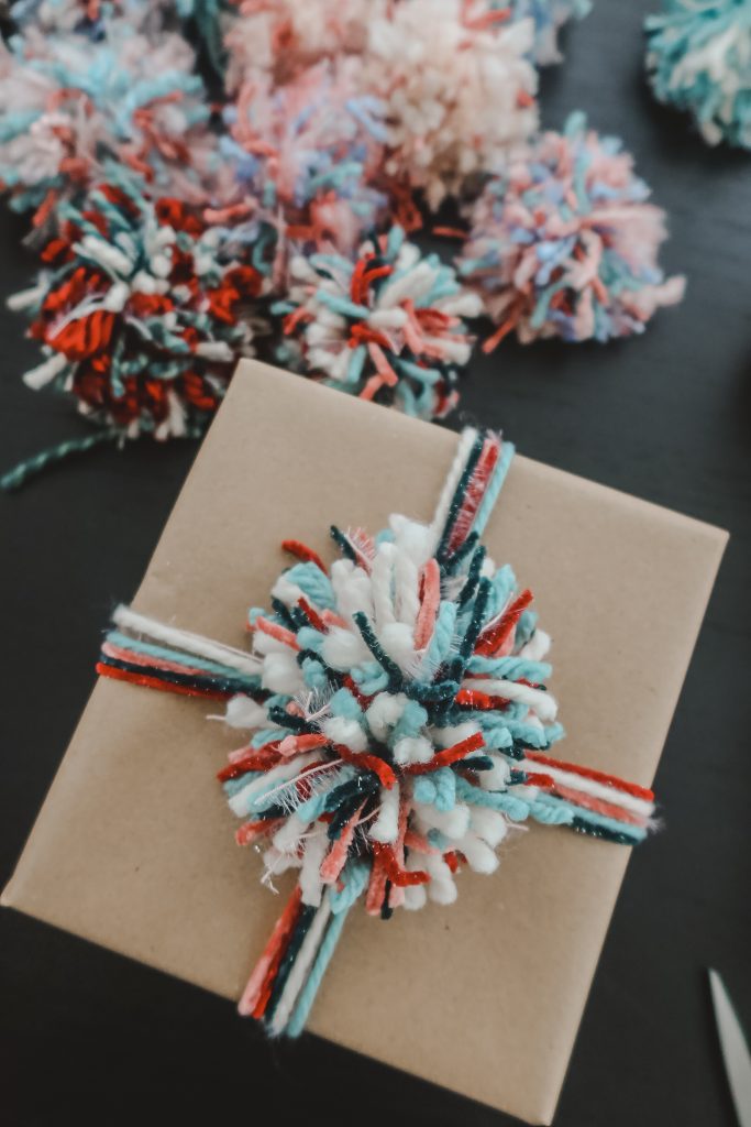 Cute and simple Christmas gift wrap with pom pom