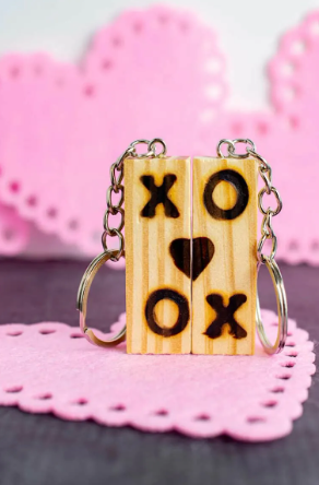DIY Tumbling Tower Blocks Keychain with a X O and a heart shape wood burned stamp on them
