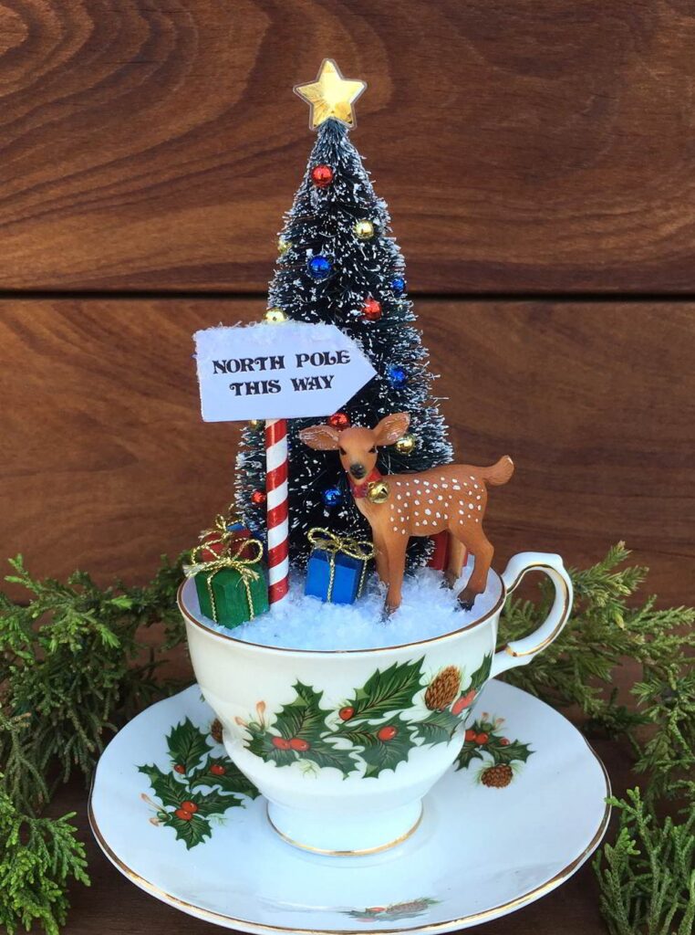 Teacup Christmas Scene it has a cute little deer and the perfect sized bottlebrush tree.