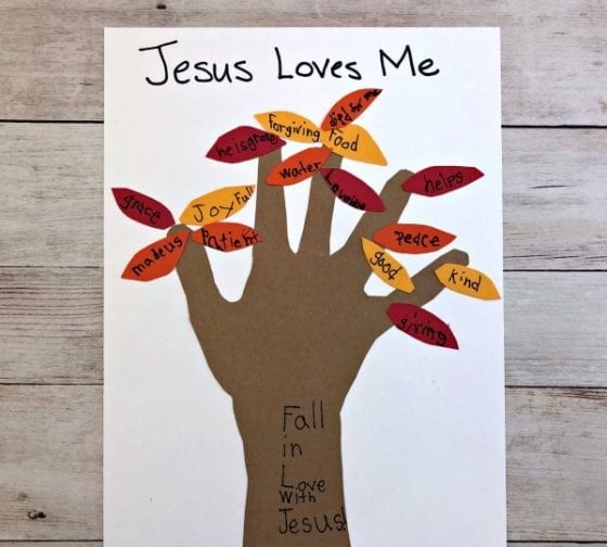 fall handprint Sunday school craft for kids says “Jesus Loves Me”
