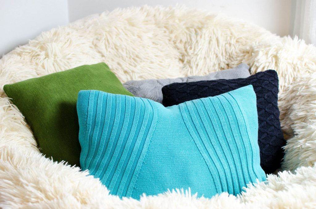 DIY sweater pillows a great way to reuse an old sweater and turn them into cozy home decor